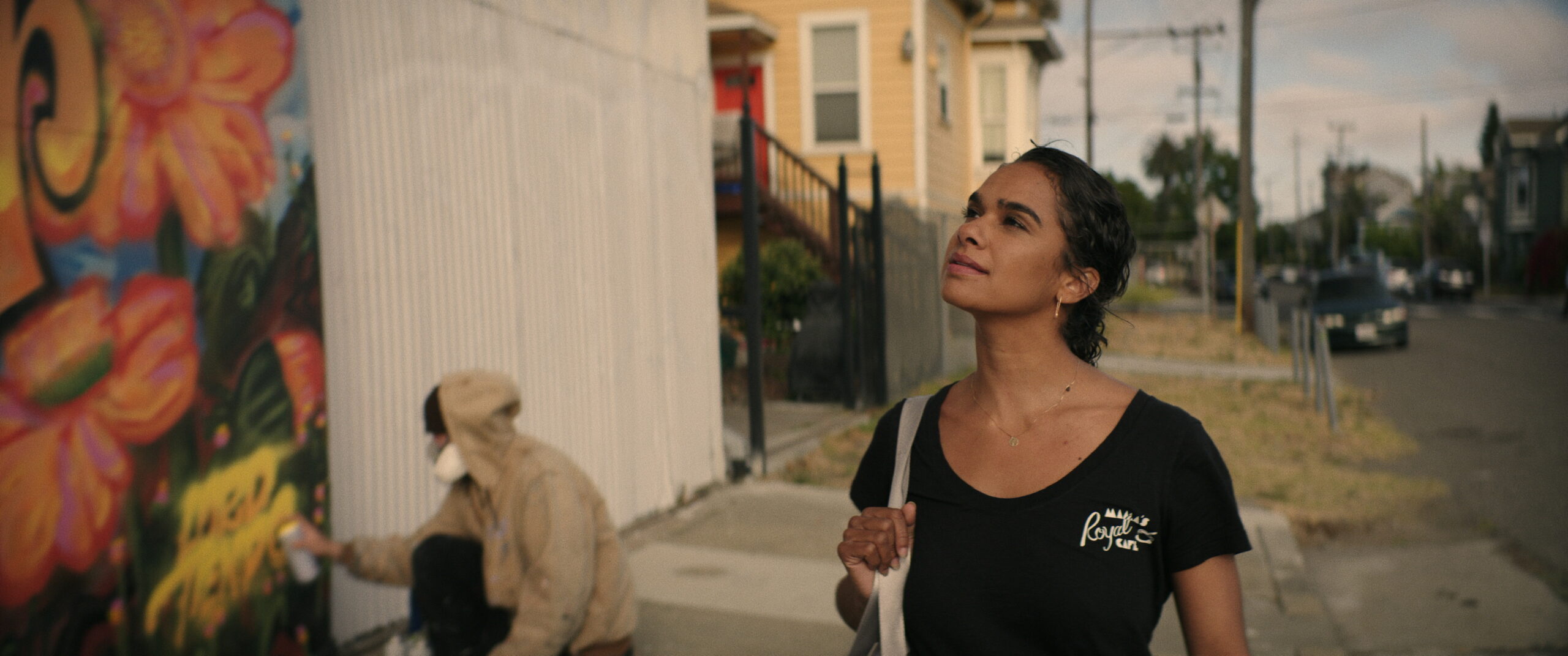 FLOWER_STILL FROM FILM 4 (ROSE LOOKING AT MURAL CLOSE UP) Misty Copeland looking to the left and up at a mural