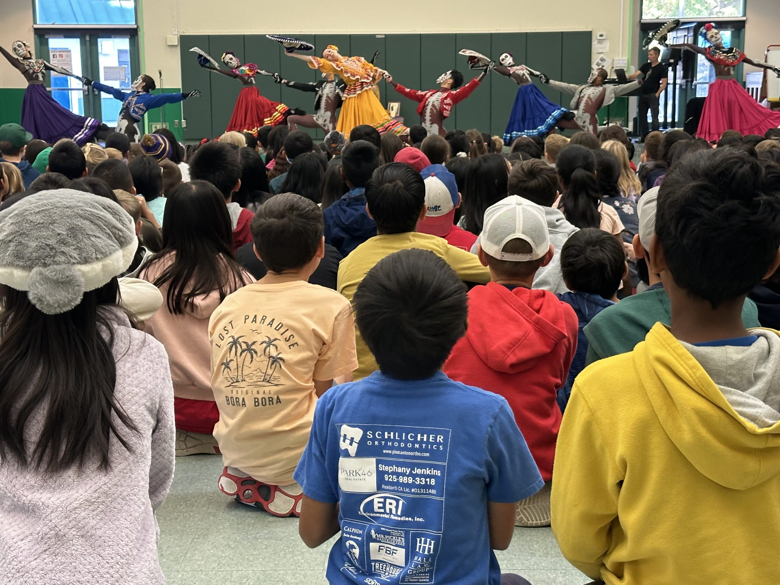 Students watching OBC dancers perform Luna Mexicana